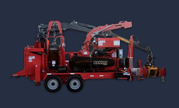Brush chipper and chip truck on a clearing job
