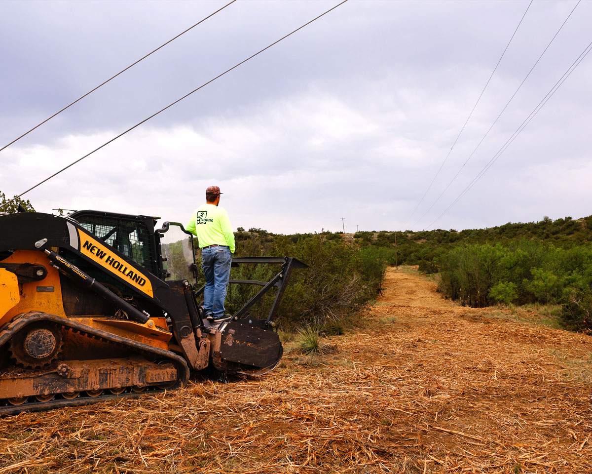 Tracked forestry mulcher cutting standing brush in one pass